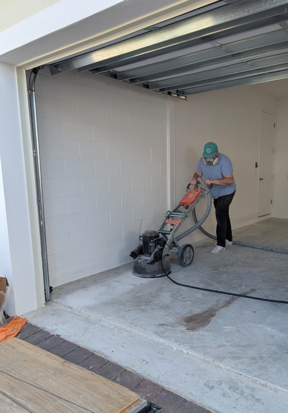 Concrete grinding prep before epoxy and polyaspartic garage floor coating