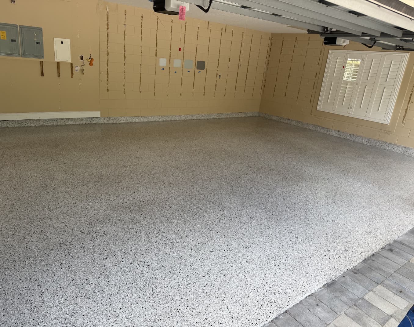 Light flake epoxy and polyaspartic garage floor coating