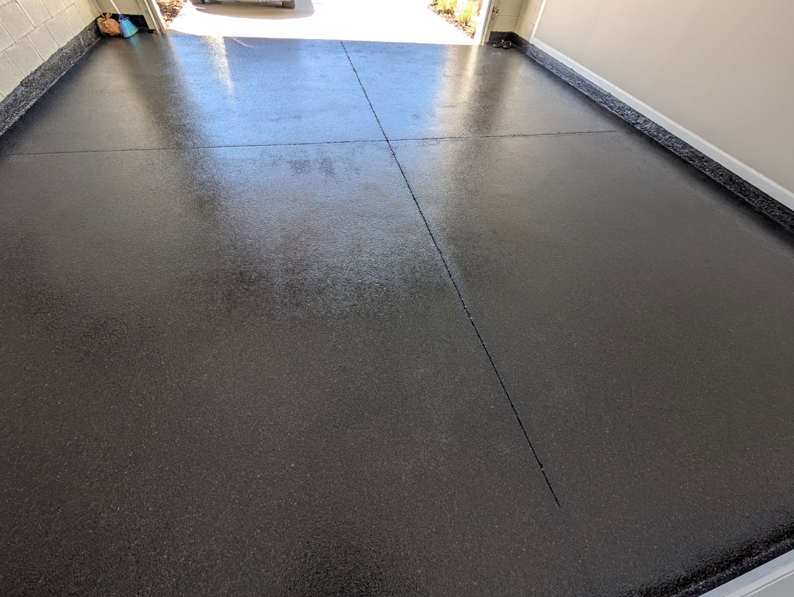 Close-up carbon flake garage floor coating texture and finish